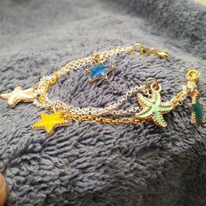 Colorful sea stars gold and silver dual tone chain linked charm bracelet
